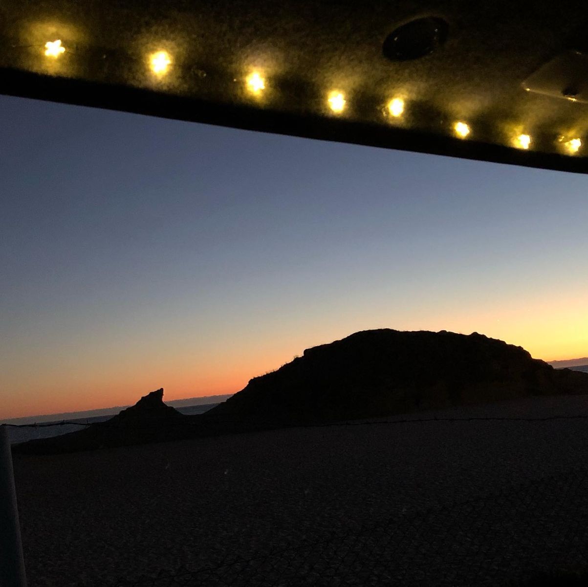 26 july 2020 suzi portugal parked on beach sunset thru van door.jpg