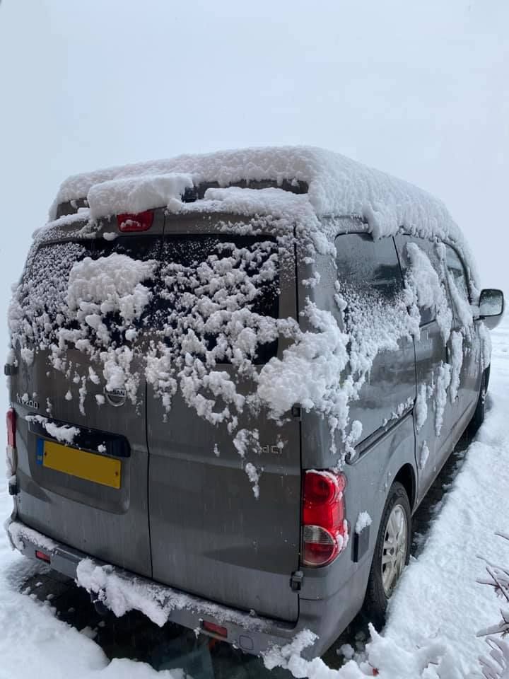 campervan covered with snow