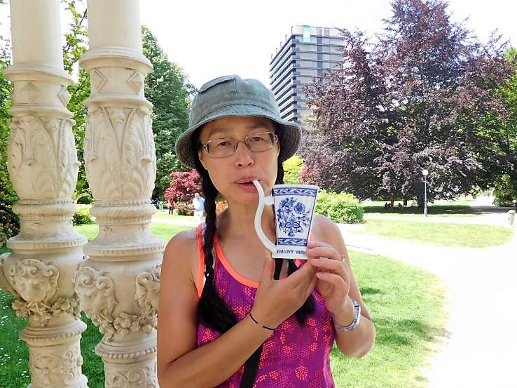 Hong holding her Karlovy Vary spring water cup